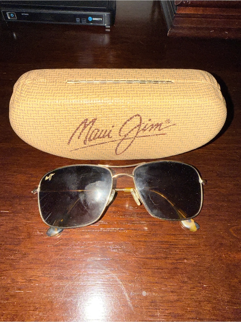 Maui Jim Gold Frame Sunglasses with Dark Lenses